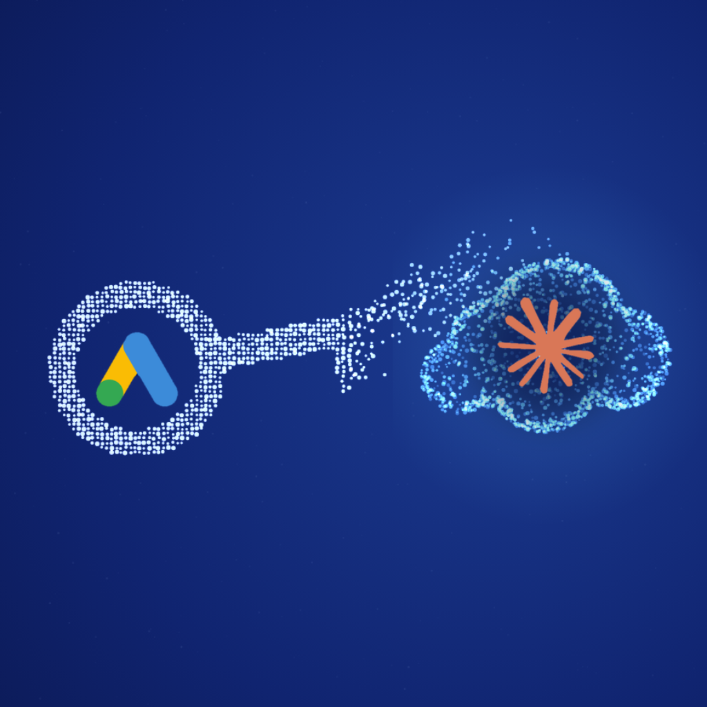 Logo di Google Ads in una chiave che si dissolve in particelle verso una nuvola con il logo di Claude: il collegamento del server MCP senza developer token